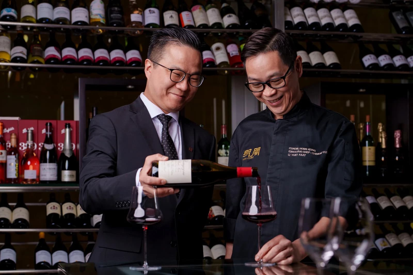 Sommelier Noble Li and Chef Li Yuet-Faat discussing a wine pairing at Ming Court