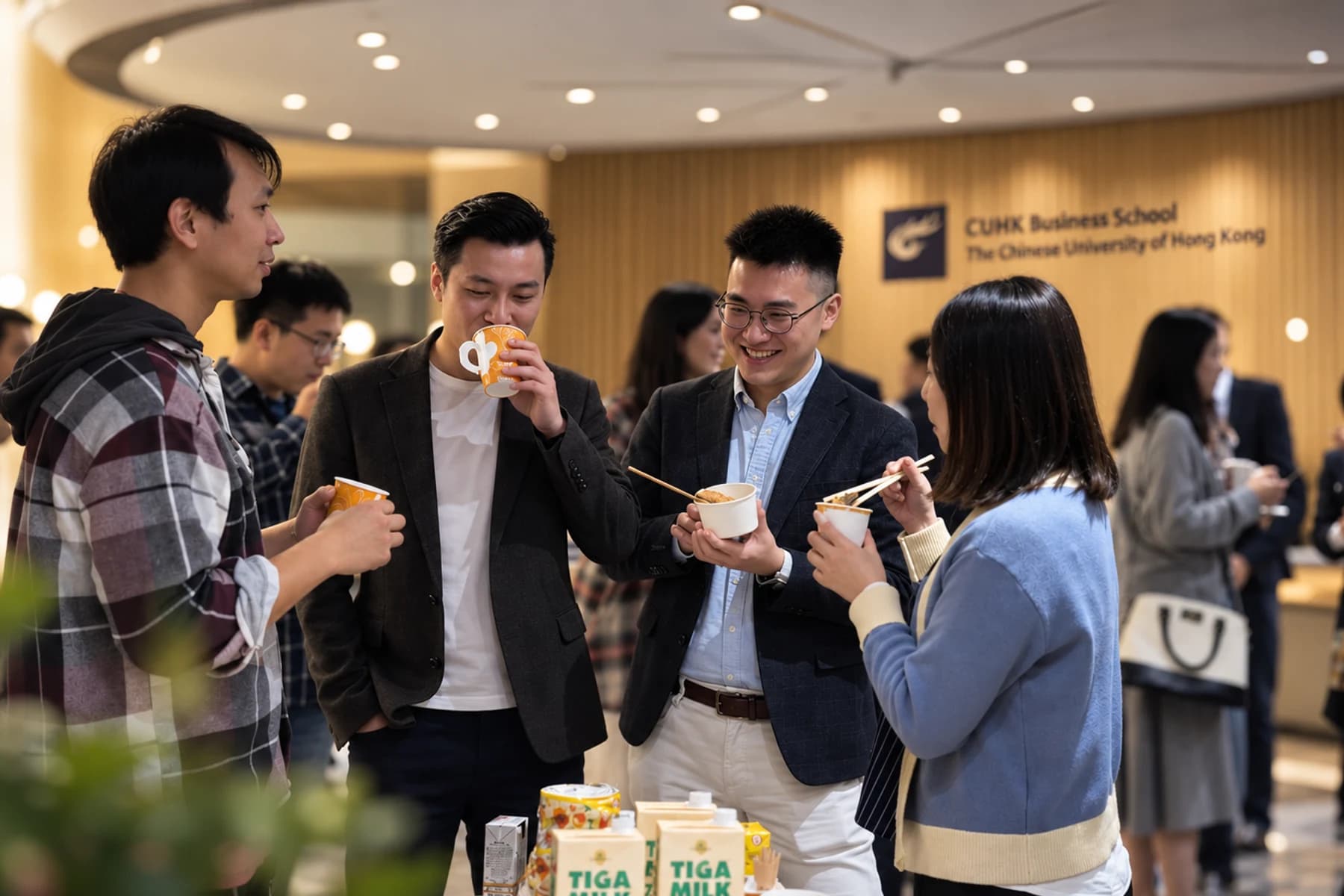 Students and guests talking at an IEC gathering pictured in the 2025–26 retrospective